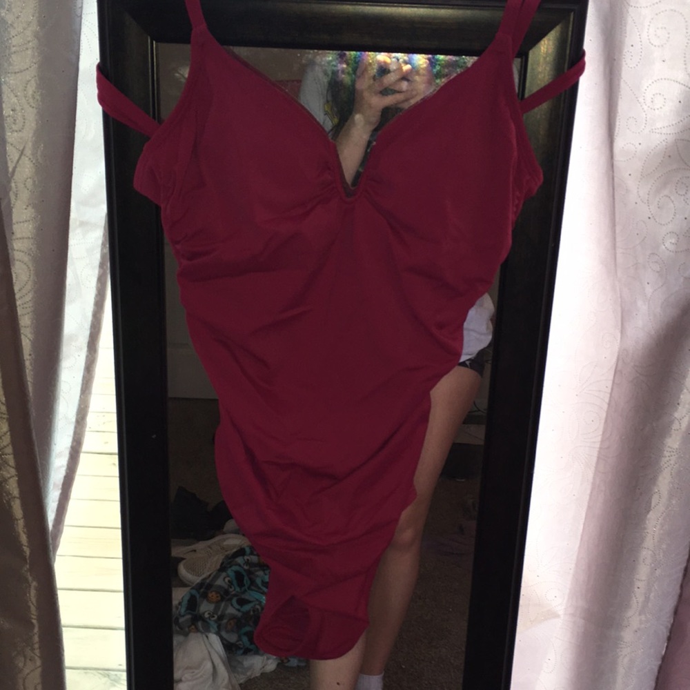 One piece swimsuit. Dark pink color